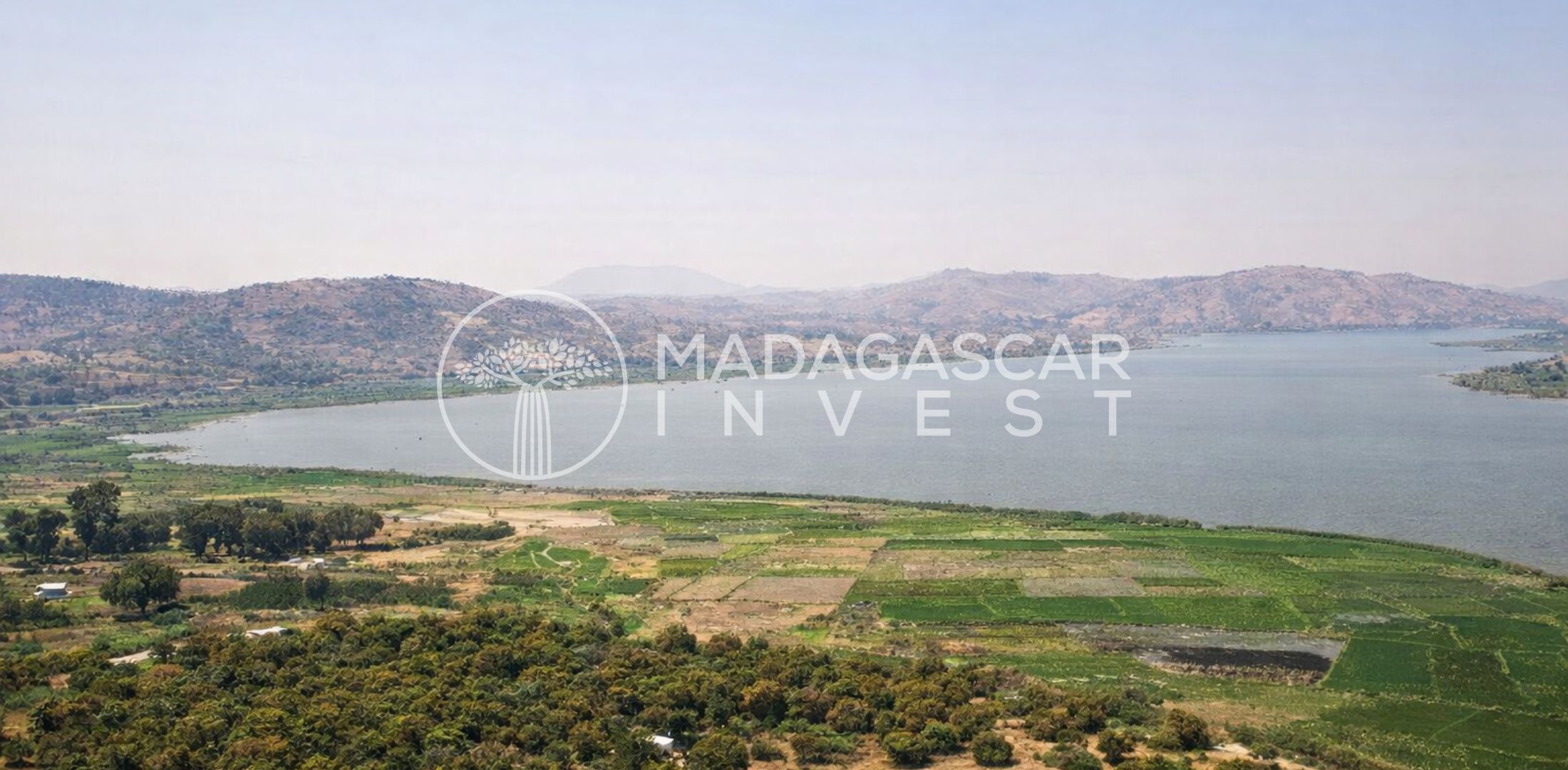 Image showing the view from a lake property near Ampefy with rolling fields in the foreground and Lake Itasy in the background