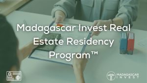 Image with the headline overlay of madagascar real estate residency program showing 2 people exchanging residency application documents